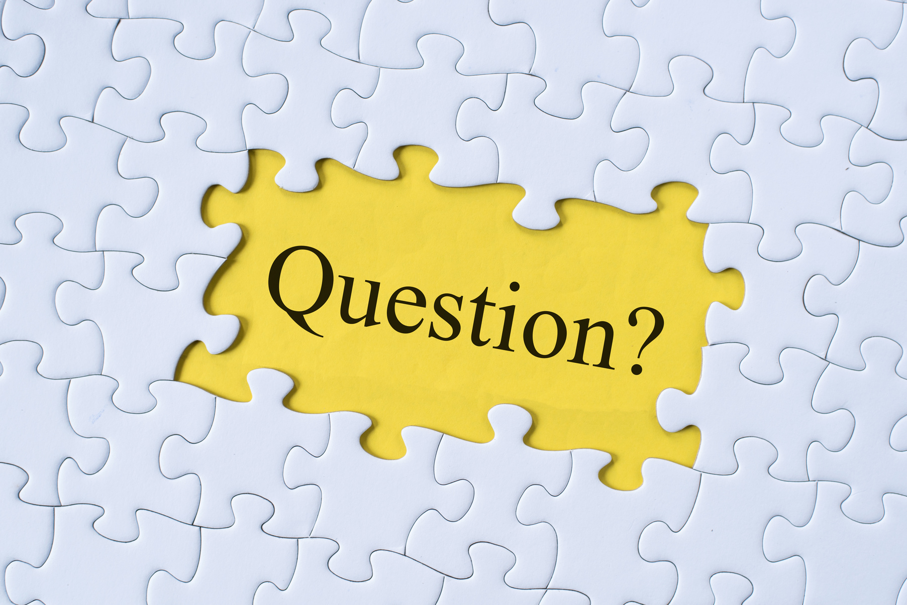 Full Frame Shot Of Jigsaw Pieces With Question Mark